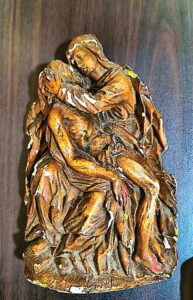 Plaster relief of Pieta di San Pietro showing Mary cradling Jesus