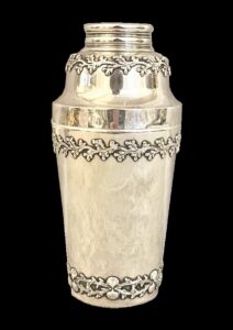 Silver Tiffany & Co. cocktail shaker with relief branch and shell trim