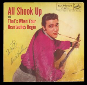 Record sleeve for "All Shook Up," yellow background, Elvis Presley portrait, personalized signature
