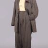 Charcoal gray pinstriped zoot suit consisting of a brimmed hat, open a jacket, and trosers on a mannequin