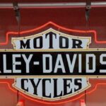 Harley-Davidson Motorcycles sign in shield and bar shape outlined in red neon light
