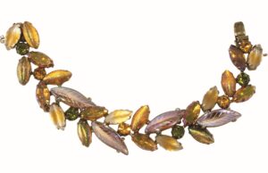 Bracelet with gold tone and iridescent glass leaf-shaped stones and rhinestones 