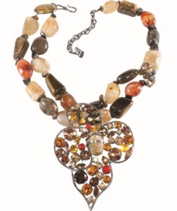 Short multicolor necklace with 2 strands of stones and a large leaf-shaped rhinestone pendant