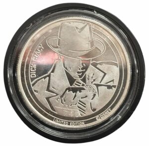 Round silver coin with image of comic character Dick Tracy