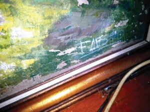 Close up of the bottom of a painting with the signature "FAVS" in capital letters