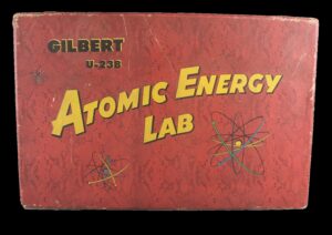 Red rectangular box with "Atomic Energy Lab" in yellow capital letters