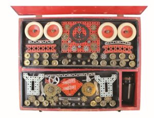 Open red box containing metal toy parts 