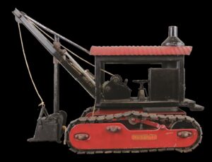 Red and black metal toy steam shovel