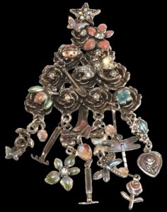 Silver tone Christmas tree pin with flowers, stones, colorful enamel, and gardening themed hanging charms